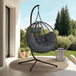 Poltrona rotonda traforata con effetto rattan grigio e cuscino grigio | IdMarket