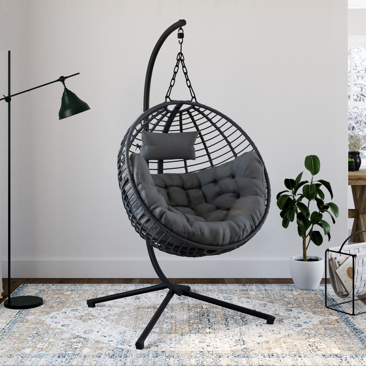 Poltrona rotonda traforata con effetto rattan grigio e cuscino grigio | IdMarket