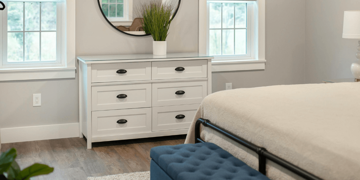 Come si fissa una cassettiera alla parete?